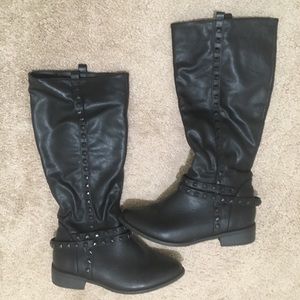 Tall studded black boots